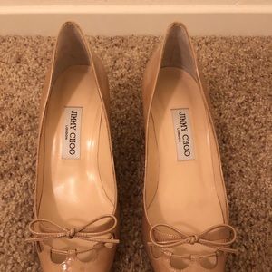 Jimmy Choo nude patent leather pump.